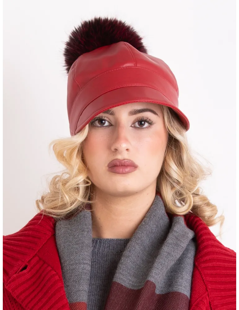 Red rain-resistant riding cap with pom-pom