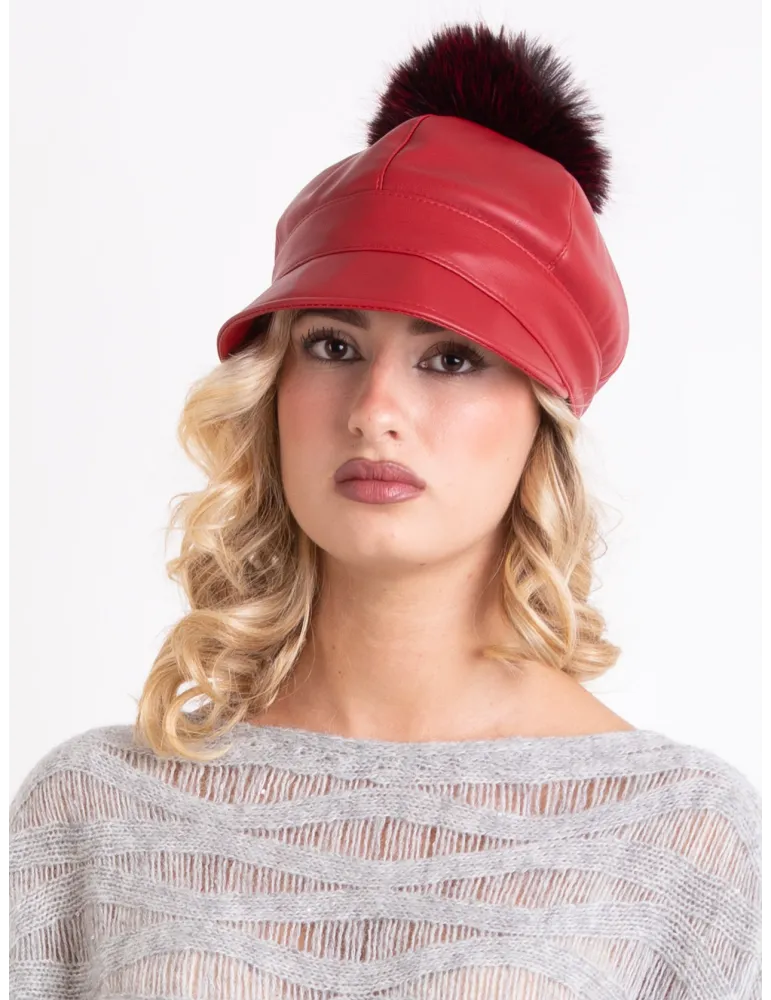 Red rain-resistant riding cap with pom-pom