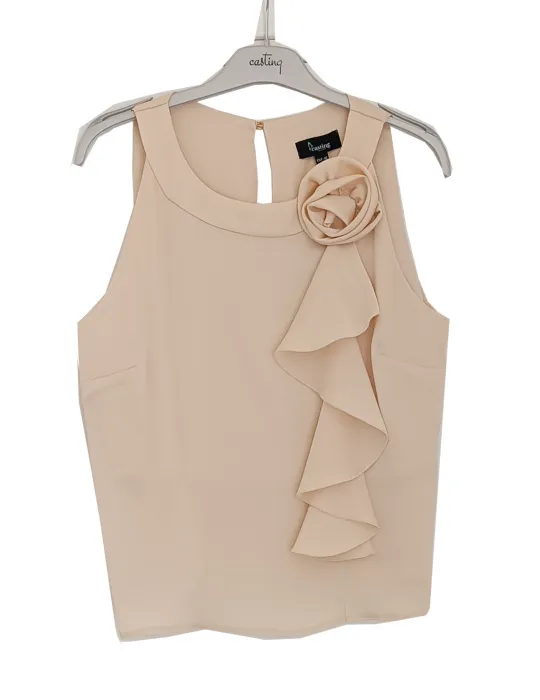 Beige satin sleeveless top with ruffle detail and floral brooch