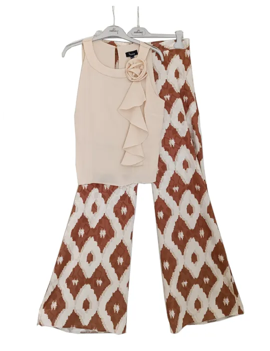 Beige satin sleeveless top with ruffle detail and floral brooch